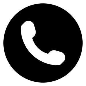 A white telephone handset icon is centered inside a solid black circle, symbolizing a phone or call function.